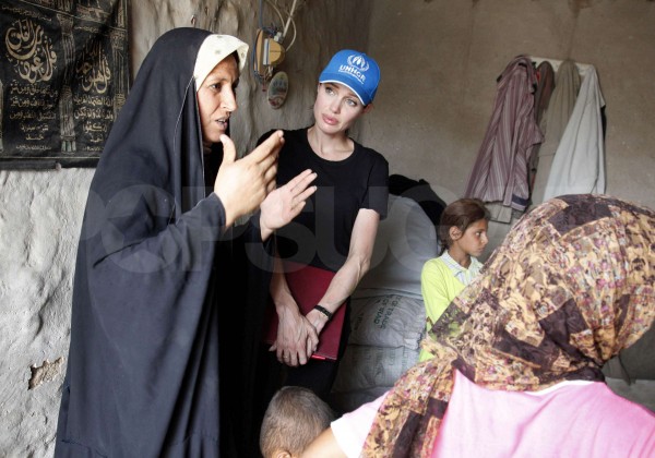 Image #: 8420126 UNHCR Goodwill Ambassador Angelina Jolie (2nd L) speaks to internally displaced people in a makeshift camp northwest of Baghdad July 23, 2009. Jolie was on a day trip in Iraq to bring attention to the plight of displaced people within and outside of Iraq. REUTERS/UNHCR/Boris Heger/Handout (IRAQ ENTERTAINMENT POLITICS IMAGES OF THE DAY) FOR EDITORIAL USE ONLY. NOT FOR SALE FOR MARKETING OR ADVERTISING CAMPAIGNS /Landov