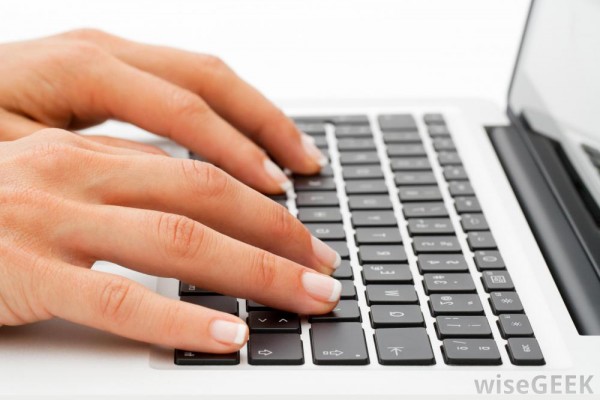 womans-hands-at-a-laptop-keyboard