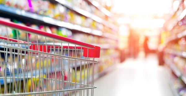 Supermarket interior, empty red shopping cart.; Shutterstock ID 169242065