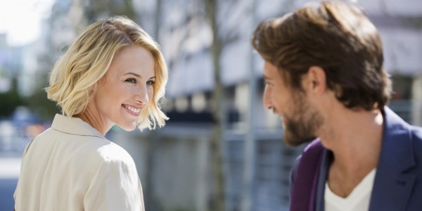 Man and woman smiling at each other