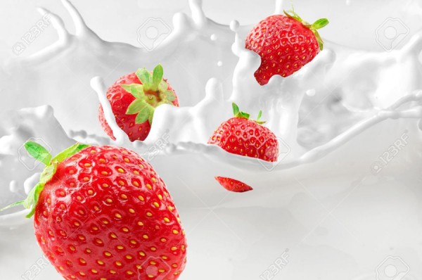 10673955-Strawberries-splashing-in-to-milk-Stock-Photo