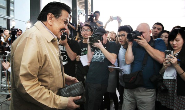 Joseph Estrada, mayor of Manila, arrives at Hong Kong International Airport in an attempt to defuse the stand-off over the 2010 bus hostage tragedy.  22APR14