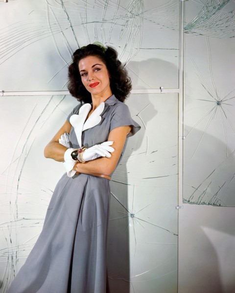 1946 --- Carol Bruce Modeling a Gray Dress --- Image by © Genevieve Naylor/Corbis