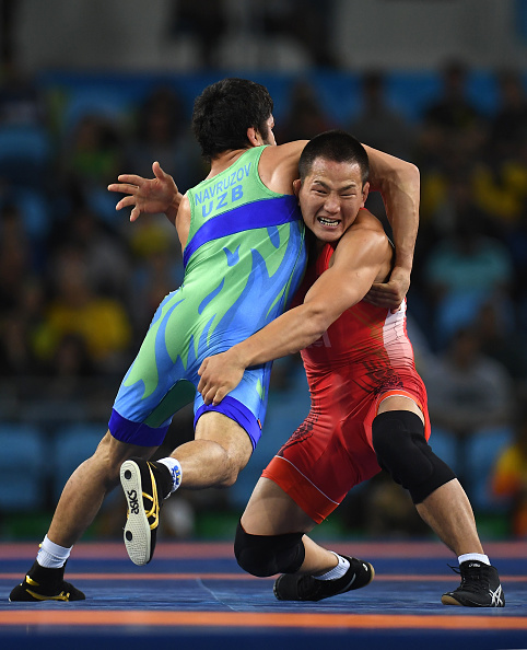 RIO DE JANEIRO, BRAZIL - AUGUST 21: Mandakhnaran Ganzorig (red) of Mongolia and Ikhtiyor Navruzov (blue) of Uzbekistan compete in the Men's Freestyle 65kg Bronze match on Day 16 of the Rio 2016 Olympic Games at Carioca Arena 2 on August 21, 2016 in Rio de Janeiro, Brazil. (Photo by Laurence Griffiths/Getty Images)