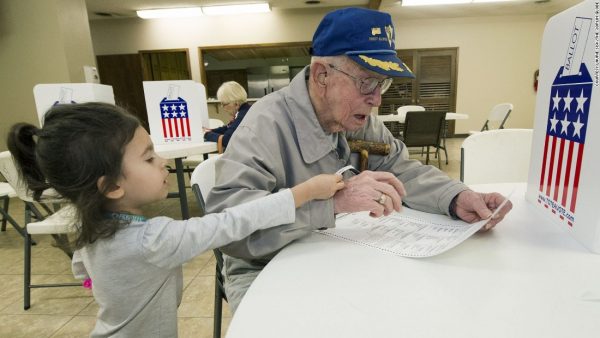 161108172925-wwii-vet-cheered-while-voting-super-169