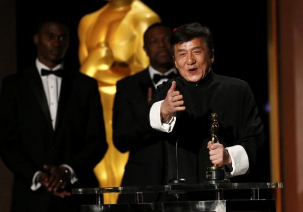 Actor Jackie Chan reacts as he accepts his Honorary Award as actor Chris Tucker (C) looks on at the 8th Annual Governors Awards in Los Angeles, California, U.S., November 12, 2016. REUTERS/Mario Anzuoni